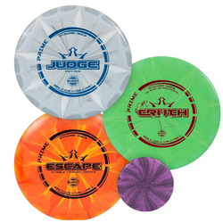 Four Dynamic Discs disc golf discs: a white Judge putter, an orange Escape driver, a green Truth fairway driver, and a small
