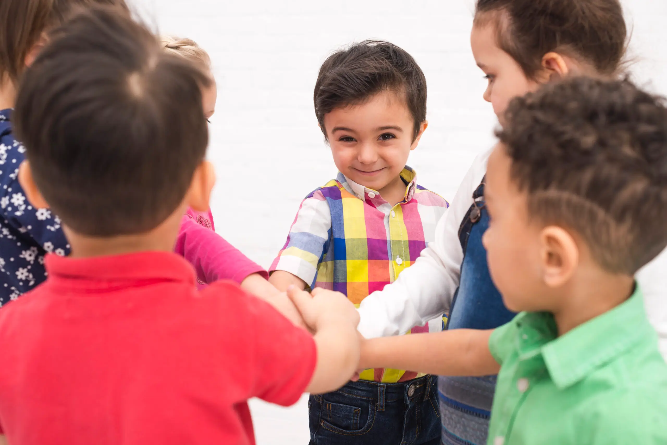 Children holding hands in a group